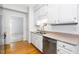 An eat-in kitchen featuring white cabinets and stainless steel appliances at 6000 Tenter Banks Sq, Raleigh, NC 27609