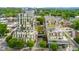 Stunning aerial view of a modern multi-story condominium complex with beautiful landscaping and rooftop terraces at 601 W Rosemary St # 905, Chapel Hill, NC 27516