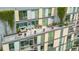 Large rooftop balcony with multiple seating areas and potted plants at 601 W Rosemary St # 905, Chapel Hill, NC 27516