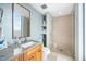 Modern bathroom with mosaic tile accent wall, granite countertops, and a glass-enclosed shower at 601 W Rosemary St # 905, Chapel Hill, NC 27516