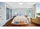 Bright bedroom features hardwood floors and access to a private balcony with scenic views at 601 W Rosemary St # 905, Chapel Hill, NC 27516