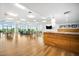 Bright common room with hardwood floors, TV, and modern furniture at 601 W Rosemary St # 905, Chapel Hill, NC 27516