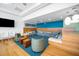 Comfortable common room with lounge seating and blue accent wall at 601 W Rosemary St # 905, Chapel Hill, NC 27516