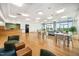 Well-lit common room features hardwood floors and comfortable seating areas at 601 W Rosemary St # 905, Chapel Hill, NC 27516