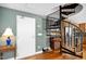 Entryway with hardwood floors, spiral staircase, and access to the kitchen at 601 W Rosemary St # 905, Chapel Hill, NC 27516