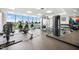 Modern gym with large windows and a variety of exercise equipment at 601 W Rosemary St # 905, Chapel Hill, NC 27516