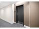 Hallway door with gray carpet and neutral colored walls at 601 W Rosemary St # 905, Chapel Hill, NC 27516