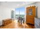 Well lit home office features beautiful wood floors and a large window with a gorgeous view at 601 W Rosemary St # 905, Chapel Hill, NC 27516
