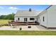 Expansive backyard with a large deck, patio, and metal roof, perfect for outdoor entertaining and relaxation at 675 Anderson Creek Rd, Henderson, NC 27537