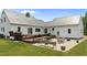 Expansive backyard featuring a spacious deck, patio area, and potential for outdoor living at 675 Anderson Creek Rd, Henderson, NC 27537