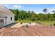Deck and patio area overlook the green backyard, creating a serene outdoor living space at 675 Anderson Creek Rd, Henderson, NC 27537