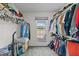Bright walk-in closet with a window and lots of storage space for clothes and accessories at 675 Anderson Creek Rd, Henderson, NC 27537