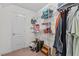 Closet with a variety of shelving, clothes, and accessories for organized storage at 675 Anderson Creek Rd, Henderson, NC 27537