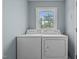 Laundry room with white washer and dryer, ready for your laundry needs at 675 Anderson Creek Rd, Henderson, NC 27537