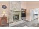 Spacious living room showcasing stone fireplace, built-in shelving, and an open floor plan at 675 Anderson Creek Rd, Henderson, NC 27537