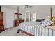 Comfortable primary bedroom with four-poster bed, dresser, and plenty of natural light at 675 Anderson Creek Rd, Henderson, NC 27537