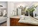 Stylish bathroom boasts granite counters, wood cabinets, modern fixtures and a beautiful vanity sink at 7015 Staghorn Ln, Raleigh, NC 27615