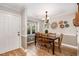Inviting dining room with a wooden table, chairs, and a window seat at 7015 Staghorn Ln, Raleigh, NC 27615
