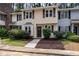 Charming townhome with brown shutters and lovely landscaped yard at 7015 Staghorn Ln, Raleigh, NC 27615