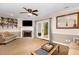 View of living room with fireplace, French doors, and decorative shelving at 7015 Staghorn Ln, Raleigh, NC 27615