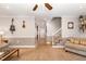 Spacious living room showcasing a staircase, neutral decor, and comfortable seating at 7015 Staghorn Ln, Raleigh, NC 27615