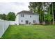 Expansive backyard featuring the home's exterior and a trampoline at 71 Hunters Way, Angier, NC 27501