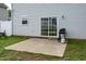Concrete patio with BBQ grill outside sliding glass doors in fenced backyard at 71 Hunters Way, Angier, NC 27501