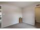 Neutral bedroom with carpet, featuring a small bookcase and adjacent doorways at 71 Hunters Way, Angier, NC 27501