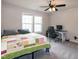 A bedroom with large windows, ceiling fan, and a desk perfect for working from home at 71 Hunters Way, Angier, NC 27501