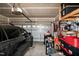 Spacious garage with car, tools, storage shelves, and automated door at 71 Hunters Way, Angier, NC 27501