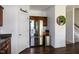 Kitchen featuring stainless steel refrigerator with wood cabinetry and flooring at 71 Hunters Way, Angier, NC 27501