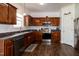 Modern kitchen featuring stainless steel appliances, wood cabinetry and lots of countertop space at 71 Hunters Way, Angier, NC 27501