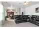 Spacious living room with plush carpeting and a comfortable leather sectional sofa at 71 Hunters Way, Angier, NC 27501