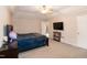 Spacious main bedroom with TV and ensuite bathroom at 71 Hunters Way, Angier, NC 27501