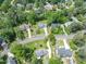 Bird's eye view showcases a home with well-maintained lawns in a tree-filled, residential neighborhood at 7209 Halstead Ln, Raleigh, NC 27613