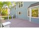 Spacious back deck with gray wood finish, white rails and supports, and beautiful landscaping in backyard at 7209 Halstead Ln, Raleigh, NC 27613