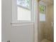 Bathroom featuring glass door walk-in shower with window providing natural light at 7209 Halstead Ln, Raleigh, NC 27613