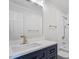 Modern bathroom features a blue vanity with gold fixtures and a separate toilet area at 7209 Halstead Ln, Raleigh, NC 27613