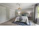 Cozy bedroom with soft lighting, neutral palette, and carpet flooring at 7209 Halstead Ln, Raleigh, NC 27613