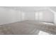 Spacious bonus room with light carpet, lots of natural light, and white trim at 7209 Halstead Ln, Raleigh, NC 27613