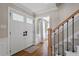 Inviting foyer with hardwood floors, staircase, and a double front door providing a warm welcome at 7209 Halstead Ln, Raleigh, NC 27613