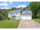 Charming two-story home with a well-manicured lawn and a two-car garage, perfect for Gathering living at 7209 Halstead Ln, Raleigh, NC 27613