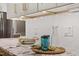 Close up of kitchen details including white backsplash, stone counters, and glasses at 7209 Halstead Ln, Raleigh, NC 27613