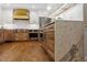 Well-equipped kitchen featuring stainless appliances, granite countertops, and custom cabinets at 7209 Halstead Ln, Raleigh, NC 27613