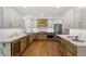 Spacious kitchen boasting custom cabinets, granite countertops, stainless steel appliances, and hardwood floors at 7209 Halstead Ln, Raleigh, NC 27613
