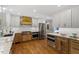 Well-appointed kitchen showcasing stainless steel appliances, custom cabinets, and ample counter space at 7209 Halstead Ln, Raleigh, NC 27613