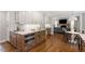 Bright kitchen with hardwood floors, breakfast table and stainless oven at 7209 Halstead Ln, Raleigh, NC 27613