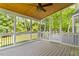 Inviting screened porch with ceiling fan and backyard views, perfect for outdoor relaxation at 7209 Halstead Ln, Raleigh, NC 27613