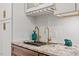 Kitchen counter with granite countertops, stainless steel sink, and brass faucet fixtures at 7209 Halstead Ln, Raleigh, NC 27613