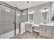 Elegant bathroom with a double vanity, granite countertops, and a large glass shower at 725 S State St, Raleigh, NC 27601